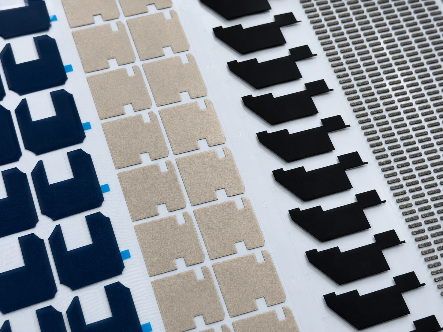 Converted EMI shielding component array including conductive fabric, foam, and laminated shielding parts