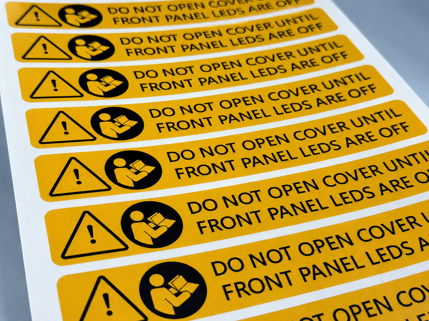 Printed warning and identification label components for industrial equipment enclosures